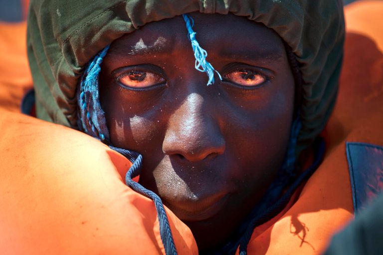 A migrant rescued from a rubber boat by members of Proactiva Open Arms NGO, in the Mediterranean sea, about 56 miles north of Sabratha, Libya, on April 6. (AP Photo/Bernat Armangue)