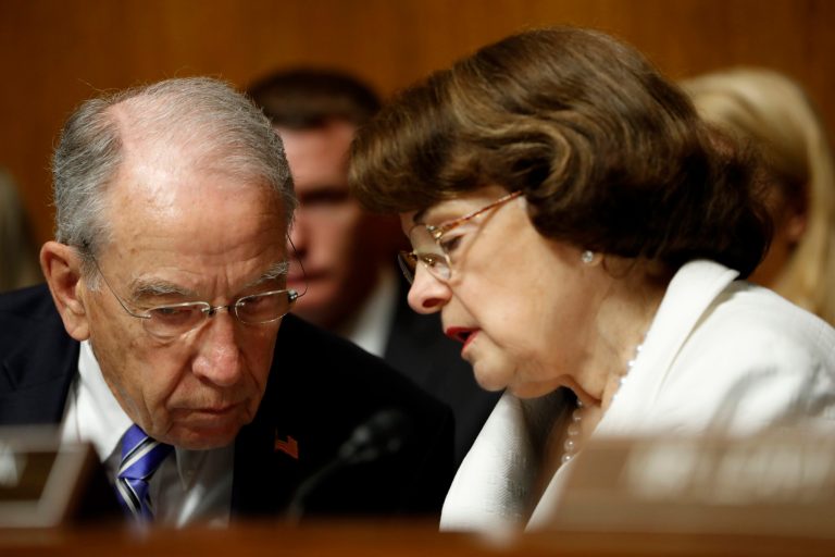 In this photo taken July 12, 2017, Senate Judiciary Committee Chairman Sen. Chuck Grassley, R-Iowa, talks with the Committee's ranking member Sen. Dianne Feinstein, D-Calif., on Capitol Hill in Washington. Glenn Simpson, the co-founder of a Washington opposition research firm that produced a dossier of salacious allegations involving President Donald Trump is to be interviewed by the Senate Judiciary Committee next week. (AP Photo/Pablo Martinez Monsivais)