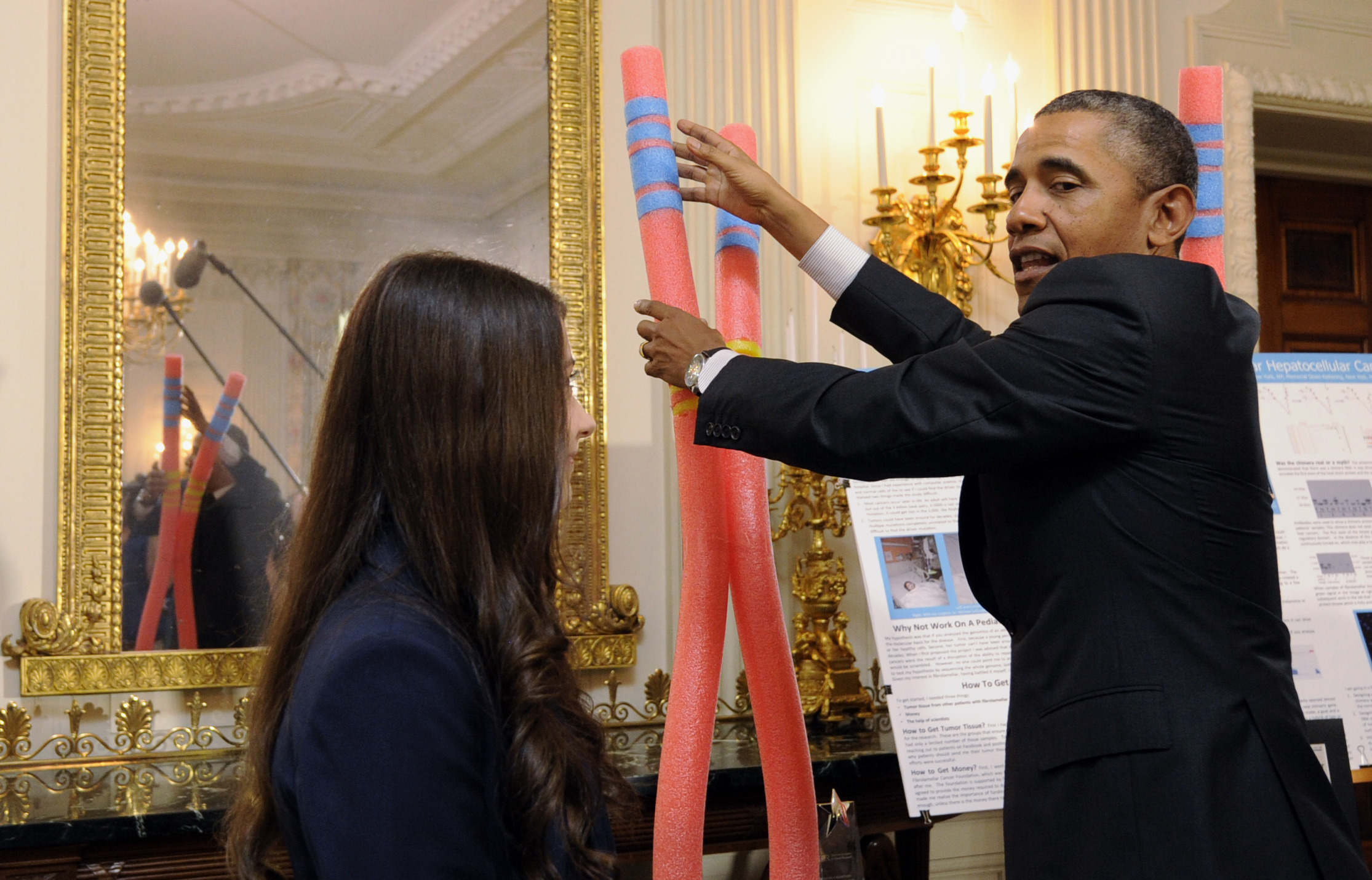 Self-effacing Obama hails science fair achievers