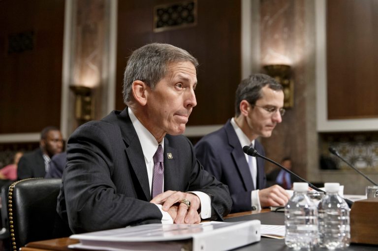 Veterans Affairs acting Secretary Sloan Gibson testifies on Capitol Hill in Washington, Wednesday, July 16, 2014, before the Senate Veterans' Affairs Committee hearing on the state of VA health care in the wake of revelations of neglect and delayed medical visits. He is accompanied by Assistant Deputy Undersecretary For Health For Administrative Operations Philip Matkowsky.   (AP Photo/J. Scott Applewhite)