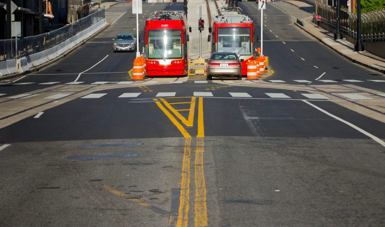 A pair of new streetcars sit parked at the bottom of Hopscotch Bridge near Union Station, Sunday, April 27, 2014 in Washington. (AP Photo/Pablo Martinez Monsivais)