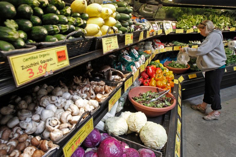 A customer shops for produce in Montpelier, Vt. Vermont's 17 food cooperatives are supporting a bill that would require the labeling of genetically modified foods. (AP Photo/Toby Talbot)