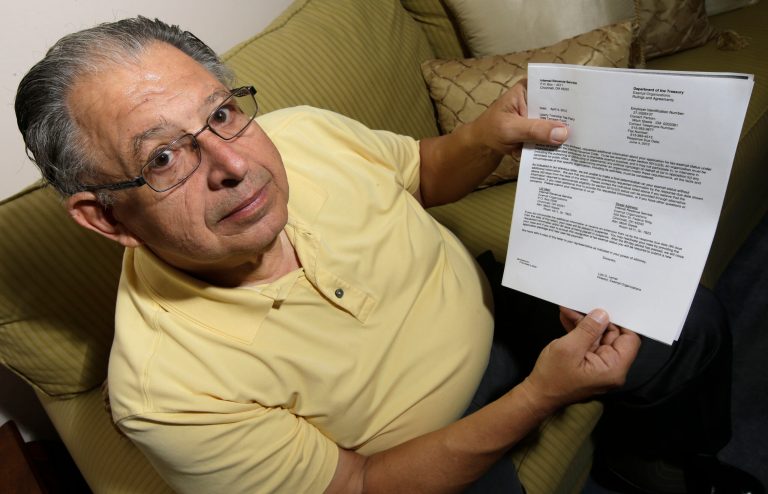 Tim Savaglio, a member of the Liberty Township Tea Party, displays one of the letters his group received from the Internal Revenue Service, Wednesday, May 15, 2013, at his home in West Chester, Ohio. (AP Photo/Al Behrman)