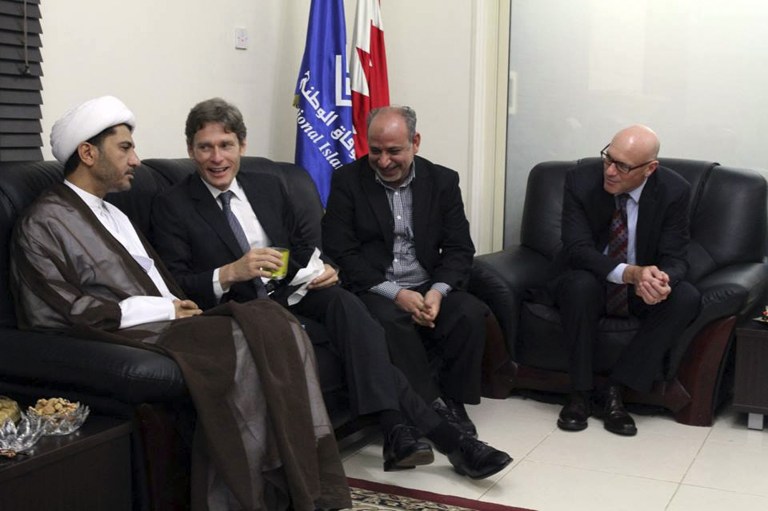 In this Sunday, July 6, 2014 photo released by the Bahraini opposition group, Al Wifaq, U.S. Assistant Secretary of State for Democracy, Human Rights and Labor Tom Malinowski, second left, visits with  Sheikh Ali Salman, head of Wifaq National Islamic Society, left, former member of the Bahraini parliament, Abdul Jalil Khalil, second right, Timothy J. Pounds, Deputy Chief of Mission at the US Embassy in Bahrain, right, and others at a traditional weekly Ramadan gathering or Majlis, in Manama Bahrain. Bahrain ordered Malinowski to leave the country on Monday after they said he met with a leading Shiite opposition group Sunday. The Foreign Ministry said Malinowski intervened in the country's domestic affairs by holding meetings with some groups at the expense of others. Al Wifaq spokesman Abdul Jalil Khalil told The Associated Press that Malinowski was scheduled to hold a joint meeting with them and other opposition groups on Tuesday. (AP Photo/Al Wifaq)