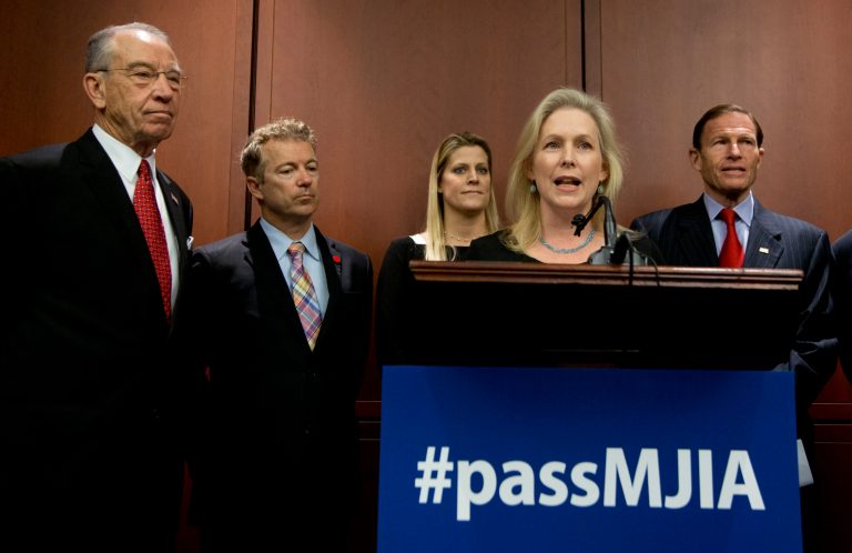 Sen. Kirsten Gillibrand, D-N.Y. front, with, from left, Sen. Charles Grassley, R-Iowa, Sen. Rand Paul, R-Ky., alleged rape victim Samantha Jackson, and Sen. Richard Blumenthal, D-Conn., speaks during a news conference on Capitol Hill in Washington. (AP Photo/Manuel Balce Ceneta)