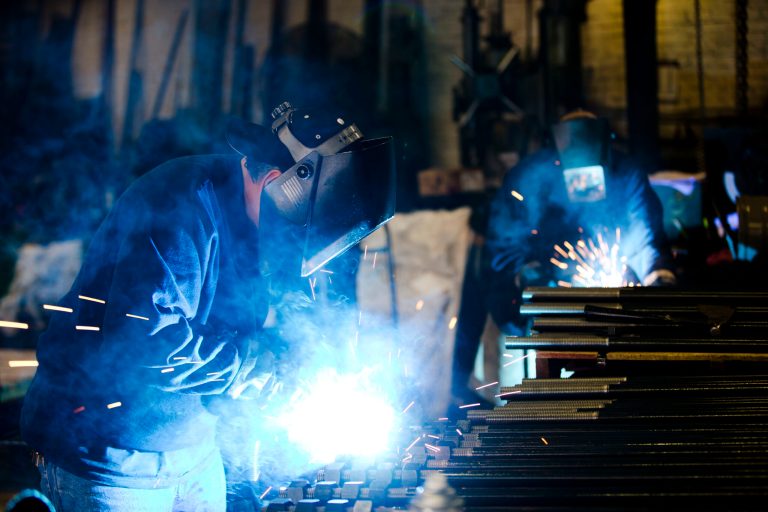 In this July 16, 2014 photo, welders fabricate anchor bolts for roads and bridges at the custom manufacture Fox Company Inc., in Philadelphia. Beyond the turmoil shaking financial markets, the U.S. economy remains sturdier than many seem to fear. (AP Photo/Matt Rourke)
