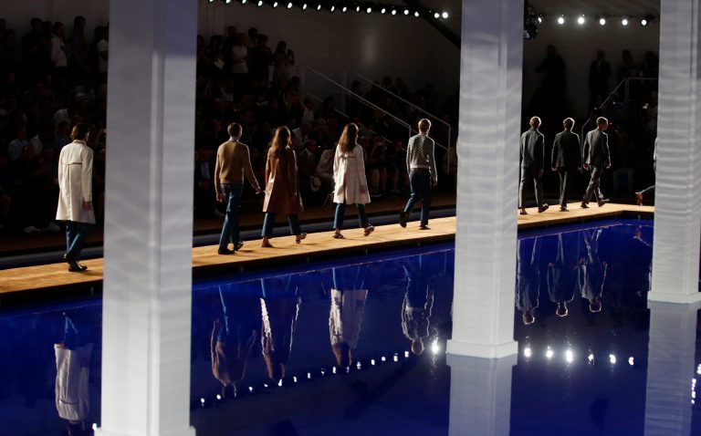 Models wear creations for Prada men's Spring-Summer 2015 collection, part of the Milan Fashion Week, unveiled in Milan, Italy, Sunday, June 22, 2014. (AP Photo/Luca Bruno)