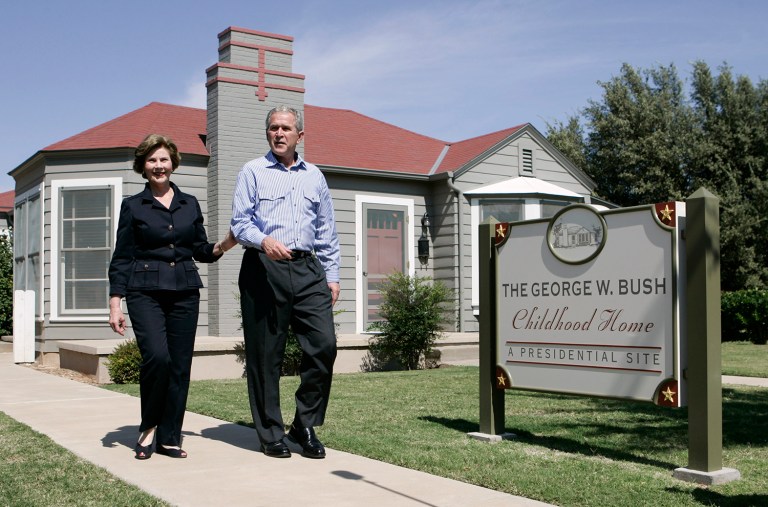 President Bush and first lady Laura Bush at the president's childhood home in Midland, Texas. A lawmaker wants the federal government to study whether the house should be designated as a national landmark. (AP Photo/Evan Vucci)