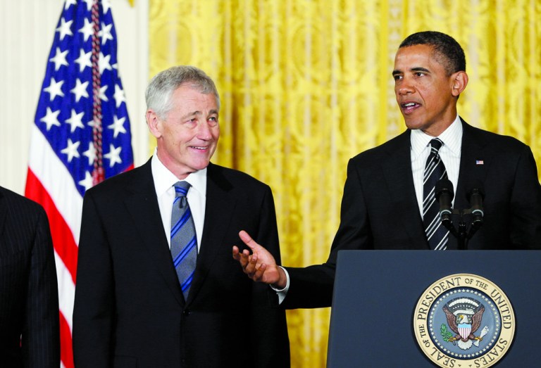 President Barack Obama speaks during a new conference in the East Room of the White House, Monday, Jan. 7, 2013, in Washington, to announce his nomination of  former Nebraska Sen. Chuck Hagel, center, as the new Defense Secretary as Current Defense Secretary Leon Panetta, stands left. (AP Photo/Carolyn Kaster)