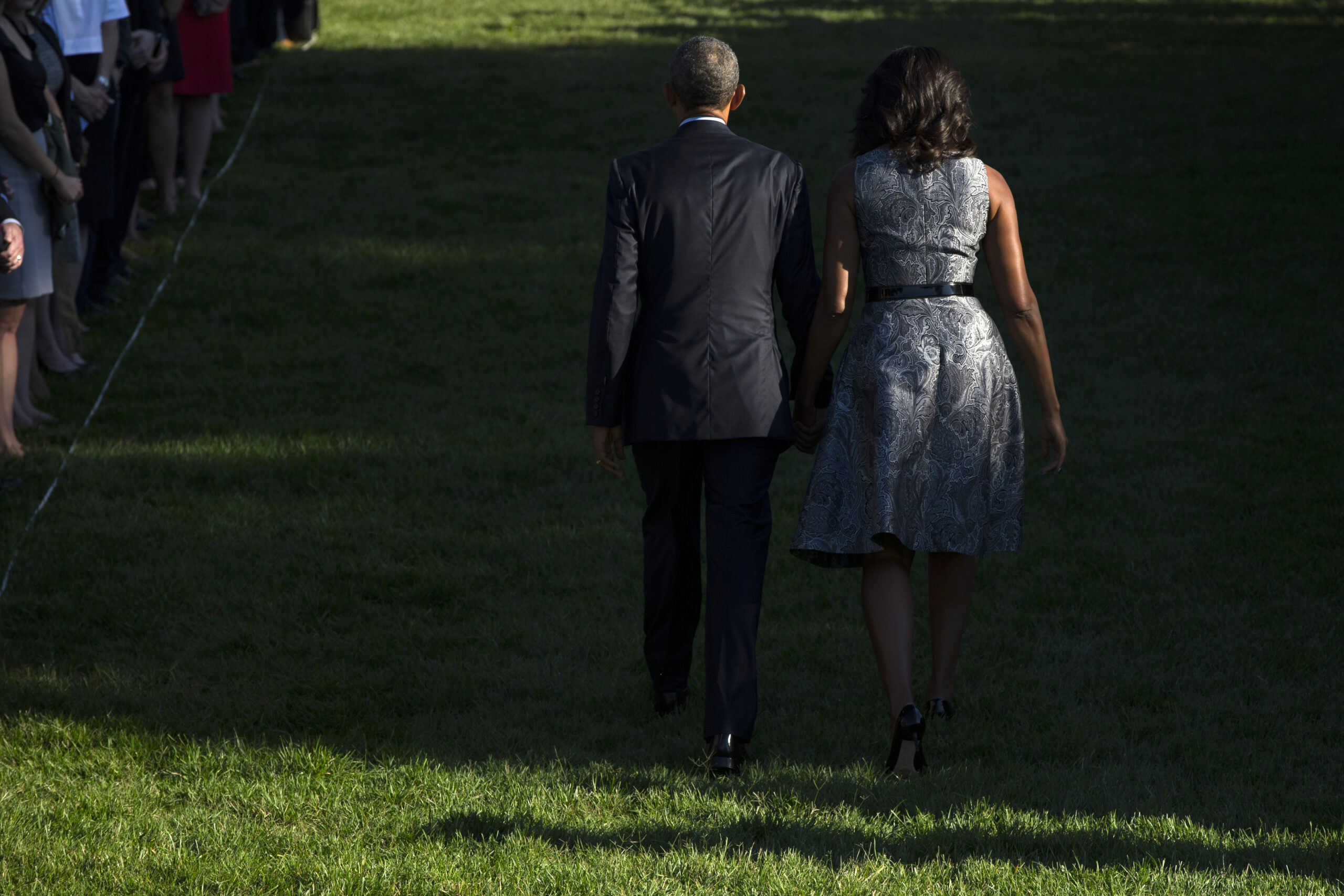 Taps, three bell tolls, hand holding at White House 9/11 ceremony