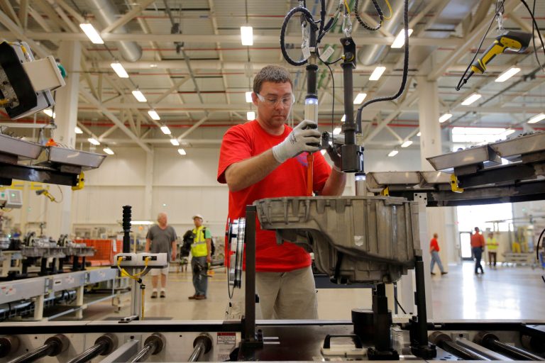 In this May 13, 2014 photo, Brian Moorman, of Russiaville, Ind., works on the line of a Chrysler transmission manufacturing facility in Tipton, Ind. The Conference Board reports on its index of leading economic indicators for April on Thursday, May 22, 2014. (AP Photo/AJ Mast)