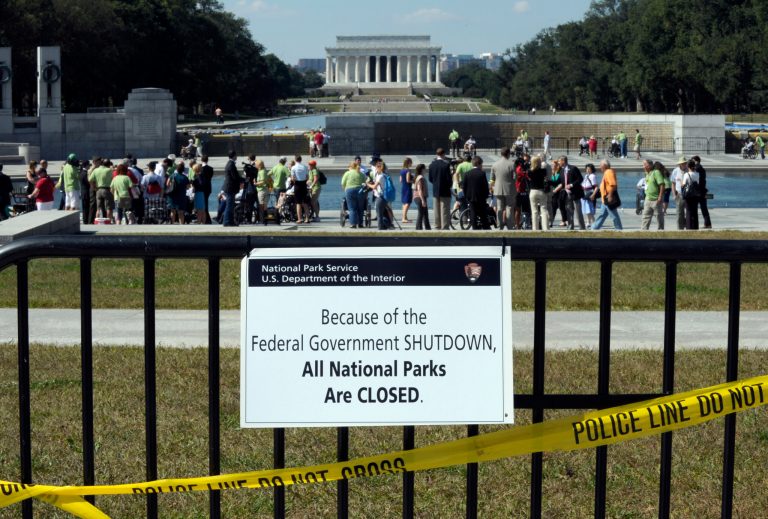 Despite signs stating that the national parks are closed, people visit the World War II Memorial in Washington, Wednesday, Oct. 2, 2013. (AP Photo/Susan Walsh)