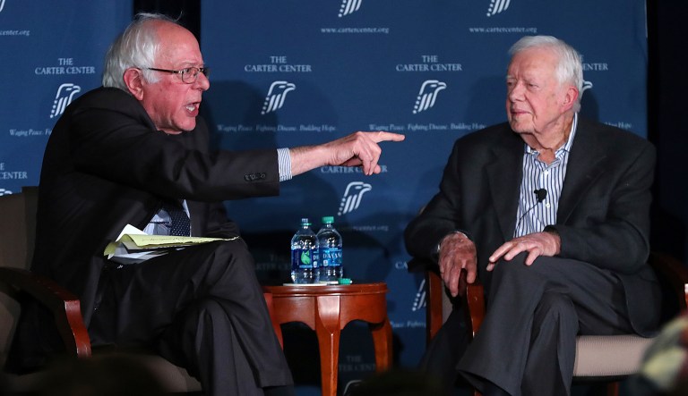 Former President Jimmy Carter and Sen. Bernie Sanders, I-Vt., discuss human rights during the Human Rights Defenders Forum at the Carter Center on Monday. Carter said he voted for Sanders in the Democratic primary. (Curtis Compton /Atlanta Journal-Constitution via AP)