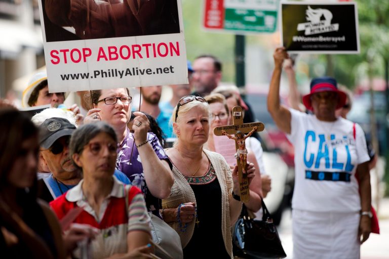 Anti-abortion activists demonstrate near a Planned Parenthood clinic Tuesday, July 28, 2015, in Philadelphia. (AP Photo/Matt Rourke)