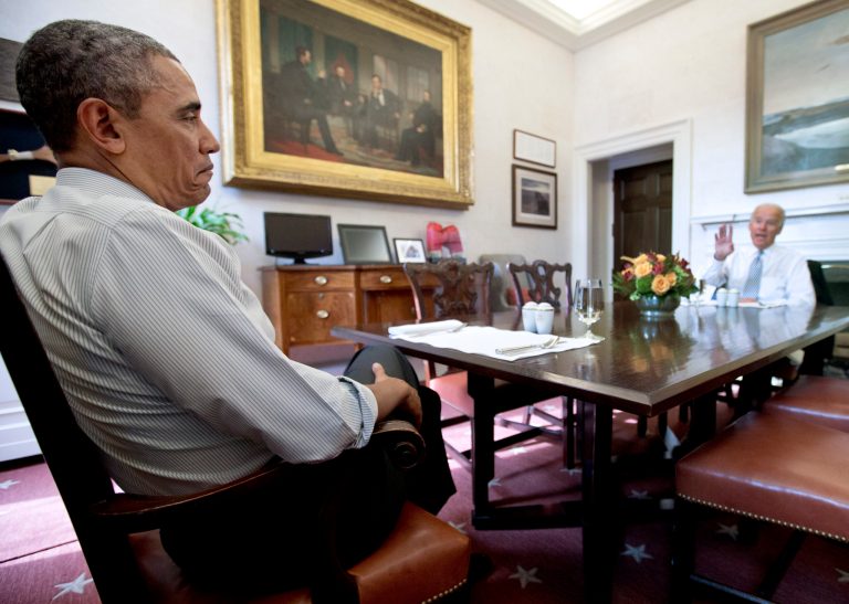 President Obama and Vice President Joe Biden talk during a photo-op as they meet for lunch in the Private Dining Room of the White House in Washington, Wednesday, Jan. 8, 2014. (AP Photo/Carolyn Kaster)