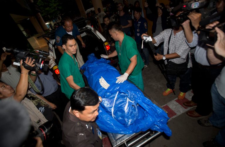 The body of slain British tourist,  David Miller, wrapped in plastic sheet, is carried at a forensic police facility in Bangkok, Thailand, Tuesday, Sept. 16, 2014. Police on the scenic resort island of Koh Tao in southern Thailand conducted a sweep of hotels and workers' residences Tuesday searching for clues into the slayings of two British tourists whose nearly naked, battered bodies were found on a beach a day earlier.(AP Photo/Sakchai Lalit)