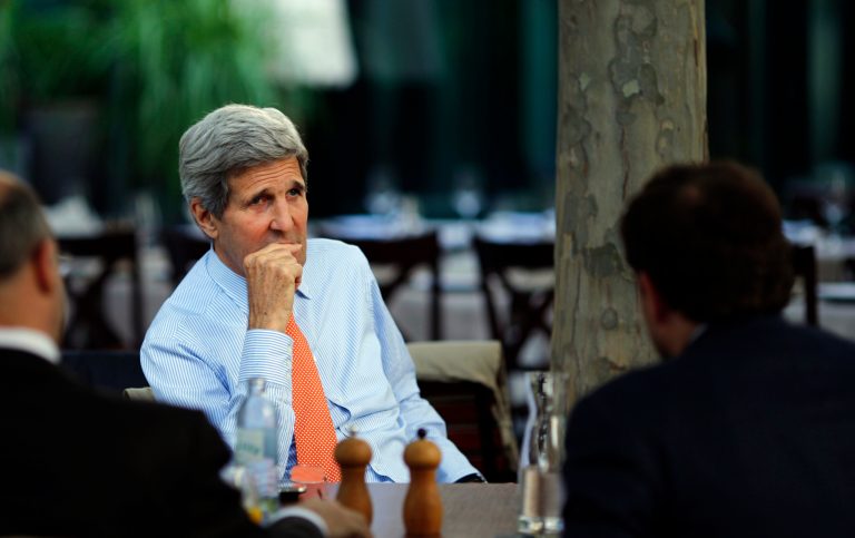 U.S. Secretary of State John Kerry, center, National Security Council point person on the Middle East Robert Malley, left, and Chief of Staff at the U.S. Department of State Jon Finer meet on the terrace of a hotel where the Iran nuclear talks meetings are being held in Vienna, Austria, Thursday, July 2, 2015. (Carlos Barria/Pool via AP)