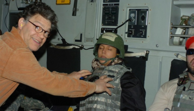 Included in Tweeden's online story is a photograph that appears to show Franken smiling at the camera with his hands on Tweeden. (Image courtesy screenshot)
