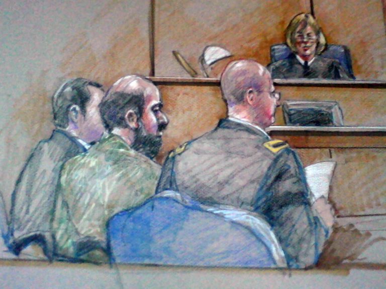 FILE - In this Dec. 18, 2012 courtroom sketch, U.S. Army Maj. Nidal Hasan, center foreground with back showing, is seen sitting between members of is defense team during a hearing in Fort Hood, Texas. The Army psychiatrist charged in the 2009 shooting rampage at Fort Hood is paralyzed from the waist down, after being shot by police that day. A judge has permitted him to represent himself at trial, but his compromised health means that his upcoming court martial will have shorter periods of testimony, more breaks and possible lengthy delays to write legal motions. (AP Photo/Brigitte Woosley, File)