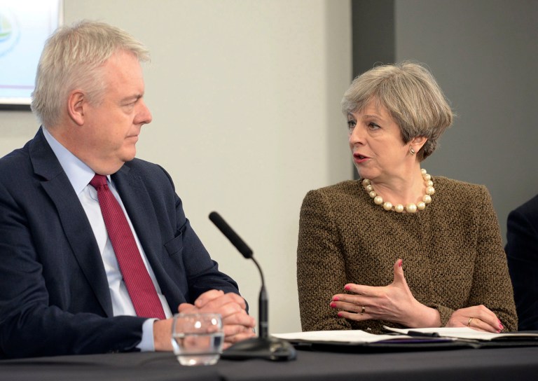 Britain's Prime Minister Theresa May and First Minister of Wales Carwyn Jones, left, attend a bilateral meeting. The European Commission says it has been informed in advance of Britain's plans to trigger its exit from the EU on March 29 and stands ready to help launch the negotiations. (Ben Birchall/PA via AP)