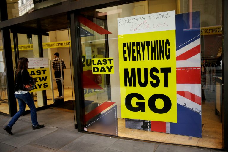 A store closing sale banner stating 