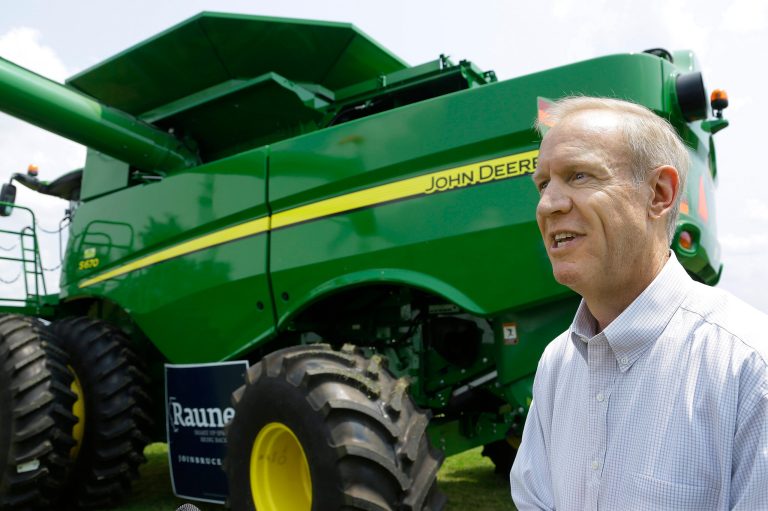 Republican candidate for governor Bruce Rauner talks to central Illinois farmers, saying a coalition from the state's agriculture industry is backing his bid to unseat Democratic Gov. Pat Quinn, Thursday, July 31, 2014, in Lincoln, Ill. Rauner, a Winnetka, Ill., businessman, says he will be a champion for agriculture, traveling the globe on his own dime to promote Illinois products and working to reduce regulatory burdens. (AP Photo/Seth Perlman)
