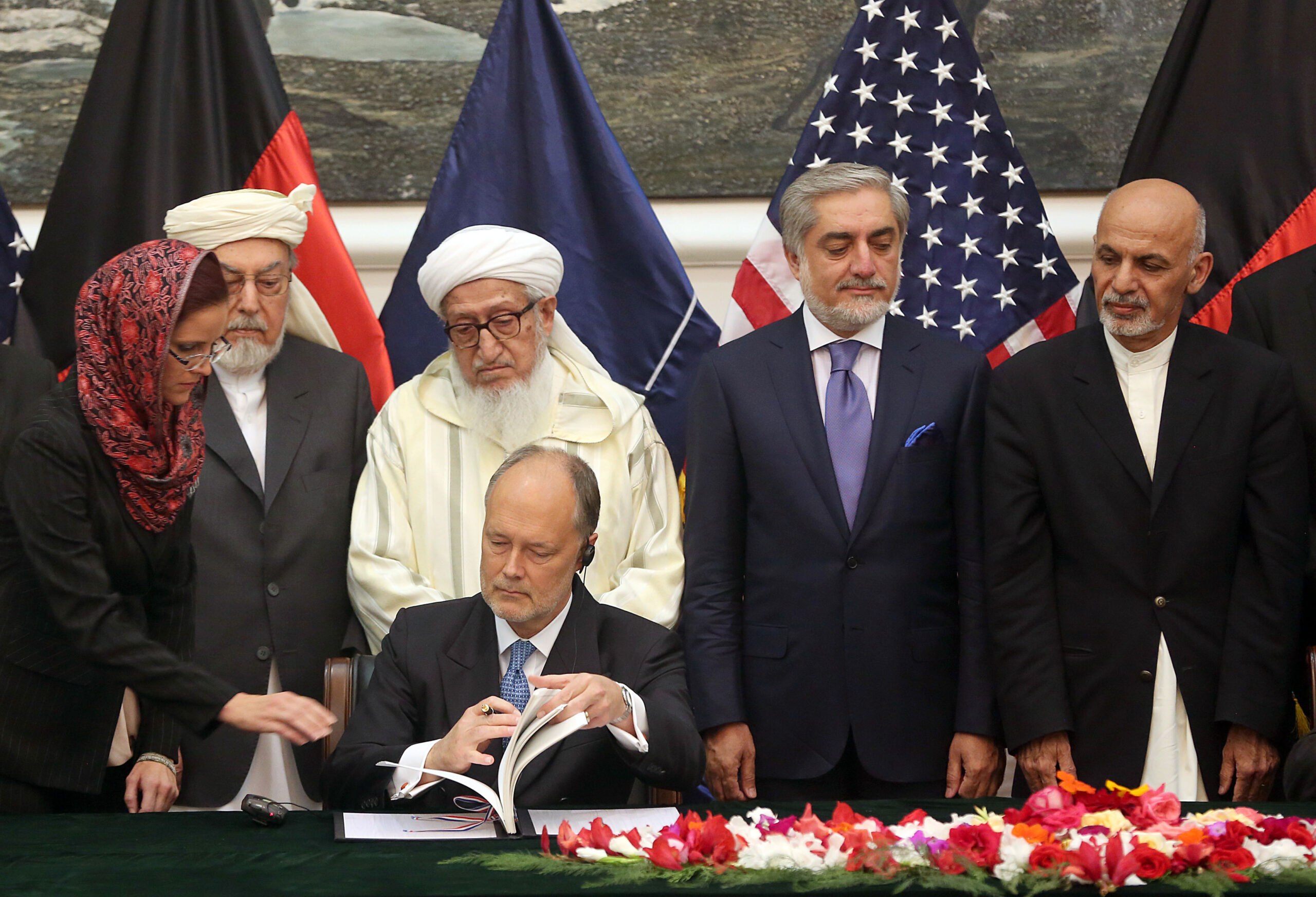 Afghan pact signed amid questions on Iraq pullout