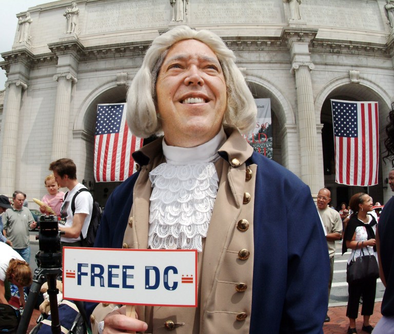 Michael Levick protests the District of Columbia's lack of voting rights and congressional representation as D.C's delegates to the DNC rally at Union Station in Washington, Saturday, July 24, 2004. (AP Photo)