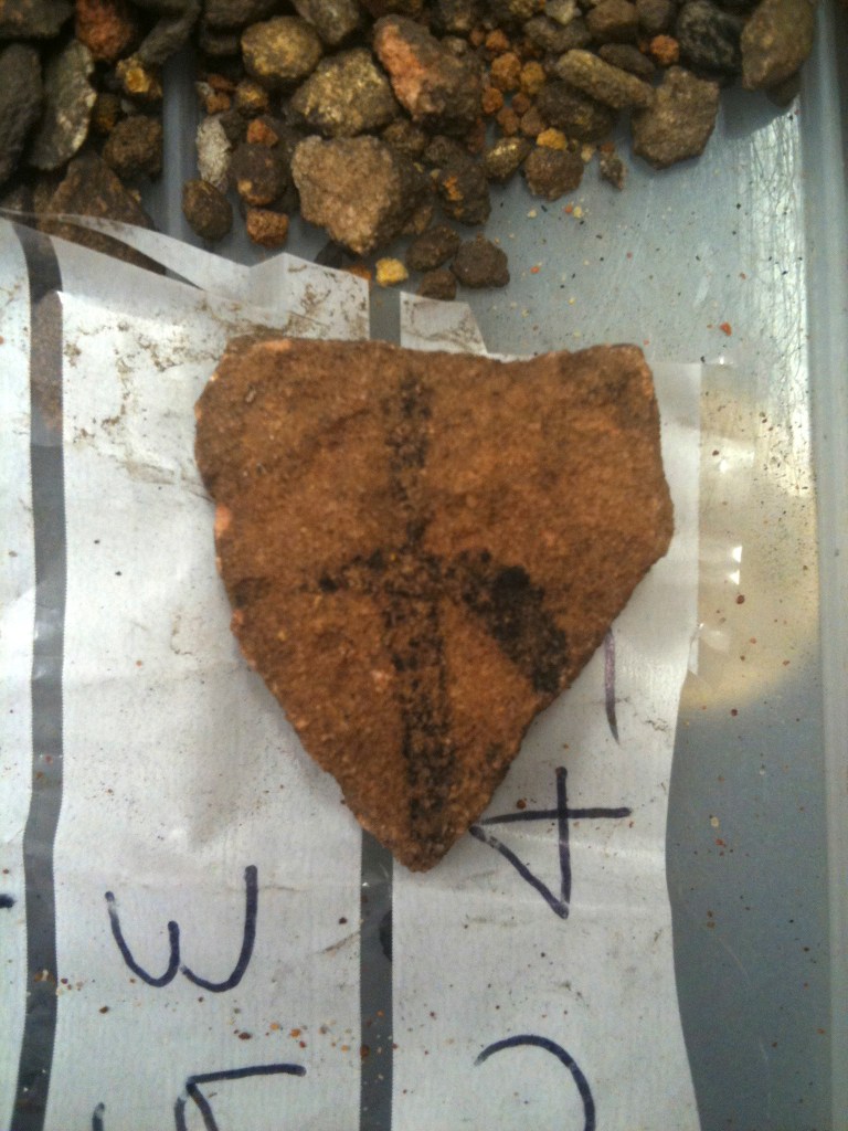   In this May 2012 photo provided by Bryce Barker, a fragment of Aboriginal rock art on granite found in Australian Outback is seen on a plastic bag. University of Southern Queensland archaeologist Bryce Barker said Monday, June 18, 2012 that tests show the Aboriginal rock art in the cave was made 28,000 years ago, making it the oldest in Australia and among the oldest in the world. The rock art was made with charcoal, so radiocarbon dating could be used to determine its age. (AP Photo/Bryce Barker) EDITORIAL USE ONLY  