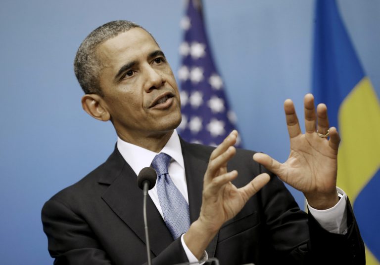   President Barack Obama gestures as he answers questions during a joint news conference with Swedish Prime Minister Fredrik Reinfeldt, Wednesday, Sept. 4, 2013, at the Rosenbad Building in Stockholm, Sweden. (AP Photo/Pablo Martinez Monsivais)  