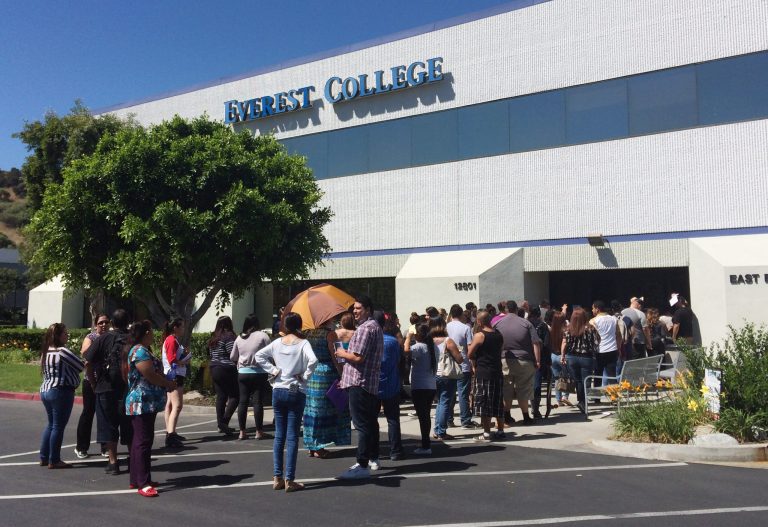 Students wait outside Everest College, in Industry, Calif., hoping to get their transcriptions and information on loan forgiveness and transferring credits to other schools. Corinthian Colleges shut down all of its remaining 28 ground campuses on Monday, April 27, displacing 16,000 students. (AP Photo/Christine Armario)