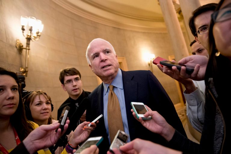 Sen. John McCain, R-Ariz. talks to reporters on Capitol Hill in Washington, Friday, Oct. 11, 2013, upon his return from a two-hour meeting at the White House between President Barack Obama and Republican senators, trying to come up with a bipartisan solution to the budget stalemate. Republicans from the House of Representatives were offering to pass legislation to avert a potentially catastrophic default and end the 11-day partial government shutdown as part of a framework that would include cuts in benefit programs, officials said Friday. But the impasse was not yet over. (AP Photo/J. Scott Applewhite)