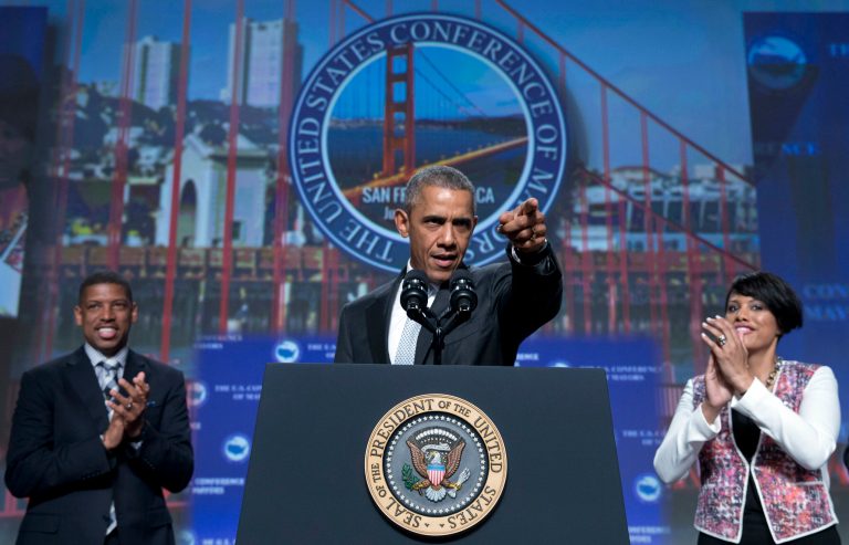 President Obama, joined by Sacramento, Calif., Mayor Kevin Johnson, left, and Baltimore Mayor Stephanie Rawlings-Blake, right, arrives to speak at the Annual Meeting of the U.S. Conference of Mayors in San Francisco, Friday, June 19, 2015. (AP Photo/Carolyn Kaster)