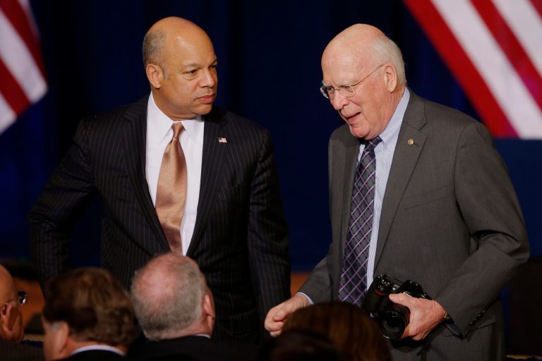 Homeland Security Secretary Jeh Johnson, left, and Senate Judiciary Committee Chairman Sen. Patrick Leahy, D-Vt., talk before President Barack Obama spoke about National Security Agency (NSA) surveillance, Friday, Jan. 17, 2014, at the Justice Department in Washington. Seeking to calm a furor over U.S. surveillance, President Barack Obama on Friday called for ending the government's control of phone data from hundreds of millions of Americans and immediately ordered intelligence agencies to get a secretive court's permission before accessing such records. (AP Photo/Charles Dharapak)