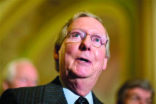 Senate Minority Leader Mitch McConnell, R-Ky., speaks with reporters following a Republican strategy session at the Capitol. (AP Photo/J. Scott Applewhite)