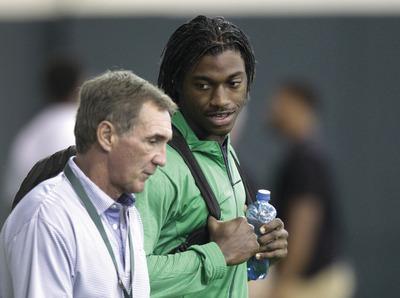 Tony Gutierrez/AP
Robert Griffin III seems destined to join Mike Shanahan and the Redskins after reports the Colts will take Andrew Luck at No. 1.