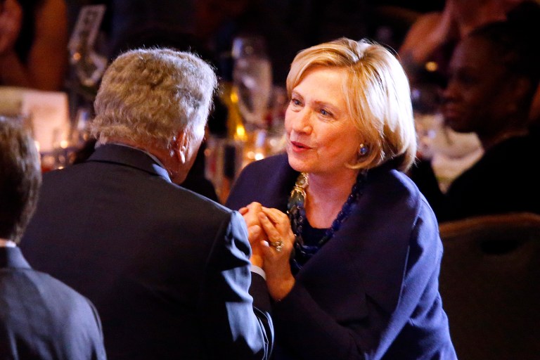 Former Secretary of State Hillary Rodham Clinton speaks to singer Tony Bennett during the Robert F. Kennedy Ripple of Hope Award ceremony, Tuesday, Dec. 16, 2014 in New York. (AP Photo/Jason DeCrow)