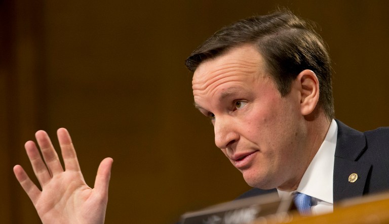 Sen. Chris Murphy, D-Conn., joins Sen. Ben Cardin, D-Md., and other members of his party in the Senate Foreign Relations Committee as they try to limit President Trump's authority to target a growing roster of extremists aligned with the Islamic State and al Qaeda across Africa and the Middle East. (AP Photo/Steve Helber)