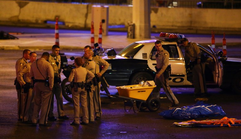 Las Vegas police gather following a deadly shooter at a music festival in Las Vegas. Islamic State claimed responsibility for the mass shooting and said the shooter converted to Islam several months ago. (Chase Stevens/Las Vegas Review-Journal via AP)