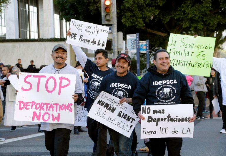 Immigration activists march in a rally against the U.S. Immigration and Customs Enforcement's (ICE) raids and deportation of immigrants near the downtown Los Angeles Federal Building. (AP Photo/Nick Ut)