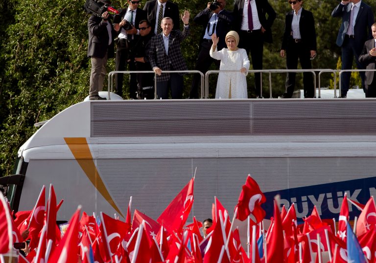 Turkish Prime Minister Recep Tayyip Erdogan and his wife Emine wave to supporters after his arrival in Ankara, Turkey, Sunday, June 9, 2013. (AP Photo/Vadim Ghirda)