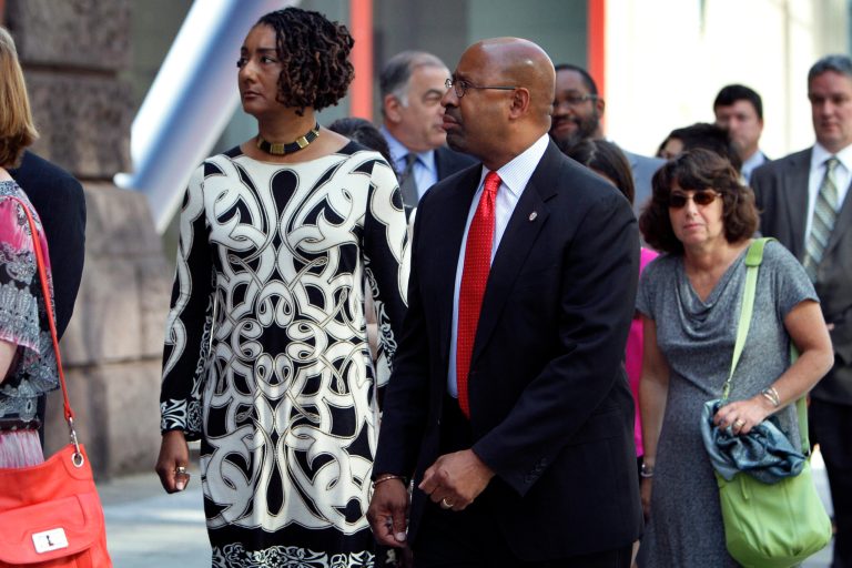 Mayor Michael Nutter, right, and his wife Lisa Nutter, left, wait in line to attend a memorial service at the Pennsylvania Academy of the Fine Arts in Philadelphia, on Sunday June 9, 2013. The service was for Anne Bryan, who was among the victims of a fatal building collapse in Philadelphia last Tuesday. (AP Photo/Joseph Kaczmarek)