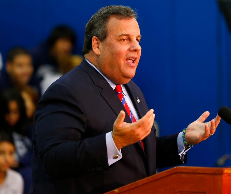 New Jersey Gov. Chris Christie talks to the media on Wednesday, a day after defeating Democratic challenger Barbara Buono to win his second term as governor. (AP Photo/Rich Schultz)