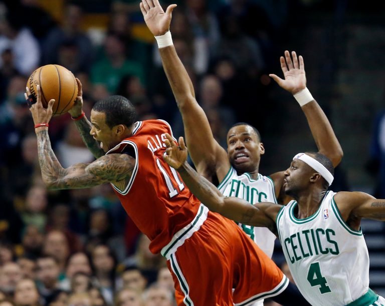   Boston Celtics' Jason Collins, center, fouls Milwaukee Bucks' Monta Ellis (11) as the Celtics' Jason Terry (4) defends in the second quarter of an NBA basketball game in Boston, Friday, Dec. 21, 2012. (AP Photo/Michael Dwyer)  