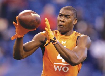 Michael Conroy/APOklahoma State receiver Justin Blackmon had 121 catches for 1,522 yards and 18 TDs in 2011.