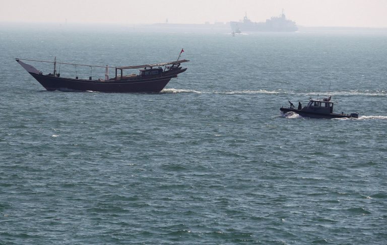 A U.S. Navy patrol boat follows a boat that passes near the USS Ponce, where Defense Secretary Chuck Hagel was taking a tour, in Manama, Bahrain, Friday, Dec. 6, 2013. Standing on the massive deck of the NavyÃ?s USS Ponce, Hagel said the U.S. is entering the new nuclear pact with Iran Ã?very clear eyedÃ? and it remains to be see whether Tehran is serious about keeping its development peaceful. (AP Photo/Mark Wilson, Pool)