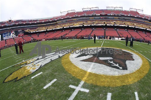 Players and coaches filter onto the grass at FedEx Field before the Washington Redskins' week 14 football game against the Baltimore Ravens in Landover, Md., on Dec. 9. (AP Photo/Paul Spinelli)