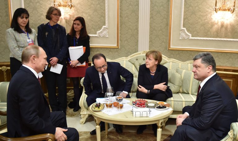 Left to right, Russian President Vladimir Putin, French President Francois Hollande, German Chancellor Angela Merkel, and Ukrainian President Petro Poroshenko talk in Minsk, Belarus, Wednesday. (AP/ Mykola Lazarenko)