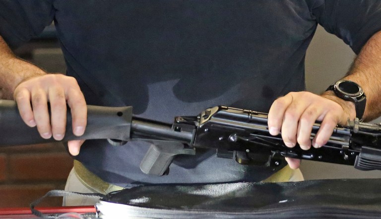 Bump stocks can be attached to semi-automatic weapons and use the recoil action of those guns to help them fire faster, effectively turning them into automatic weapons. (AP Photo/Rick Bowmer)