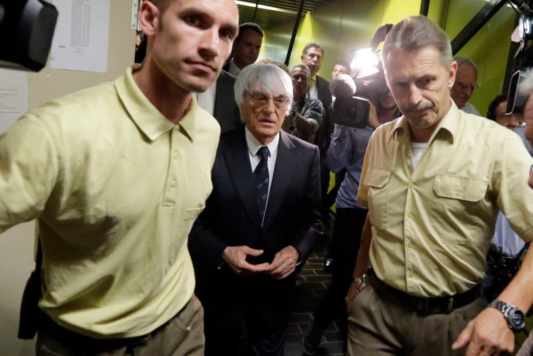 Formula One boss Bernie Ecclestone leaves the regional court in Munich, southern Germany, Tuesday, Aug.5, 2014. Ecclestone is charged with bribery and incitement to breach of trust 